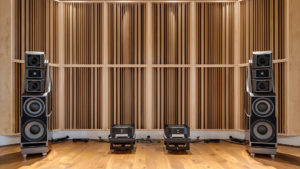 wall of acoustic sound diffusers with wilson audio speakers in front